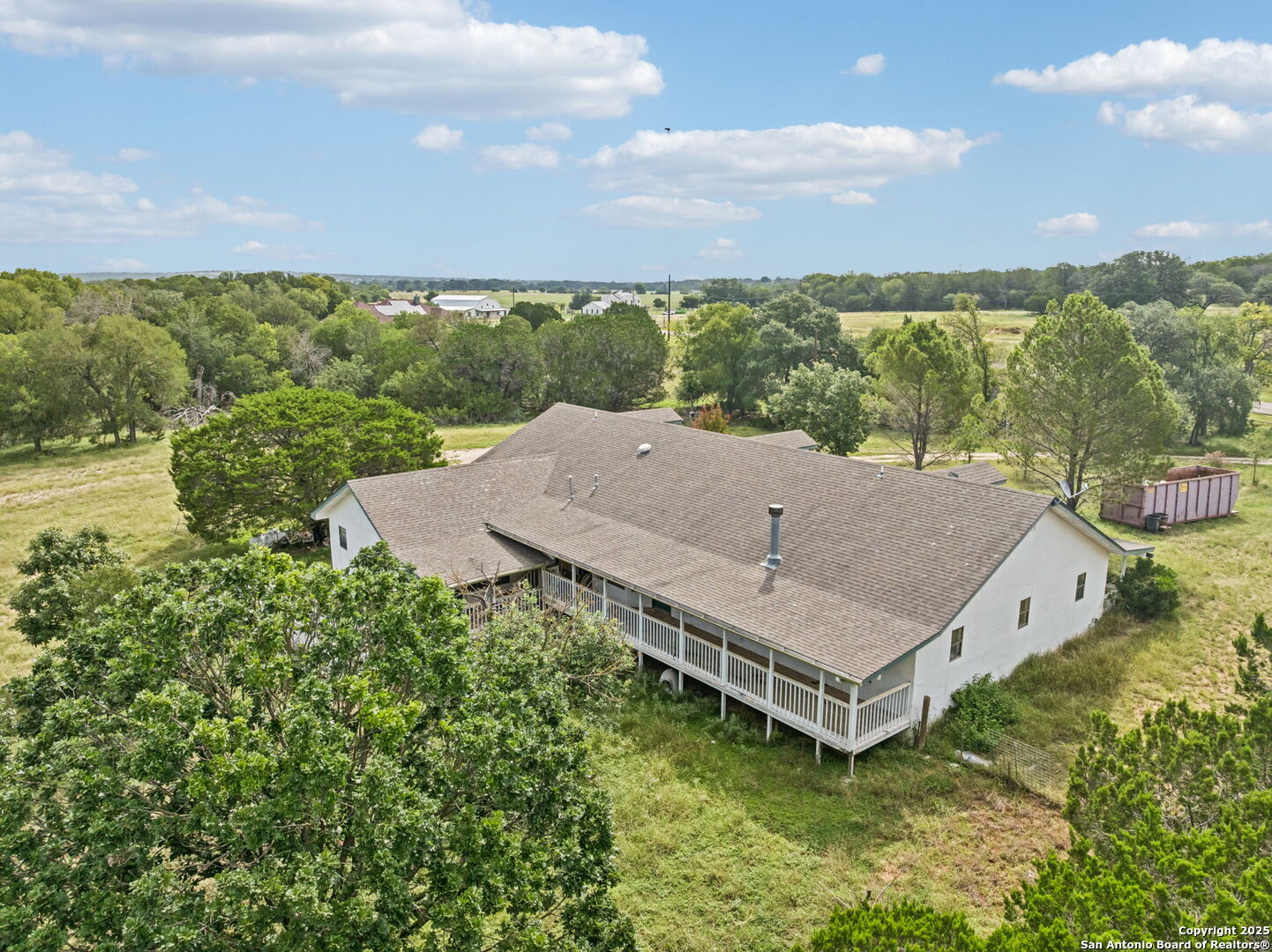 247 Center Point Drive East Center Point, TX 78010 - Photo 6 of 87 an aerial view of a house with a garden and lake view