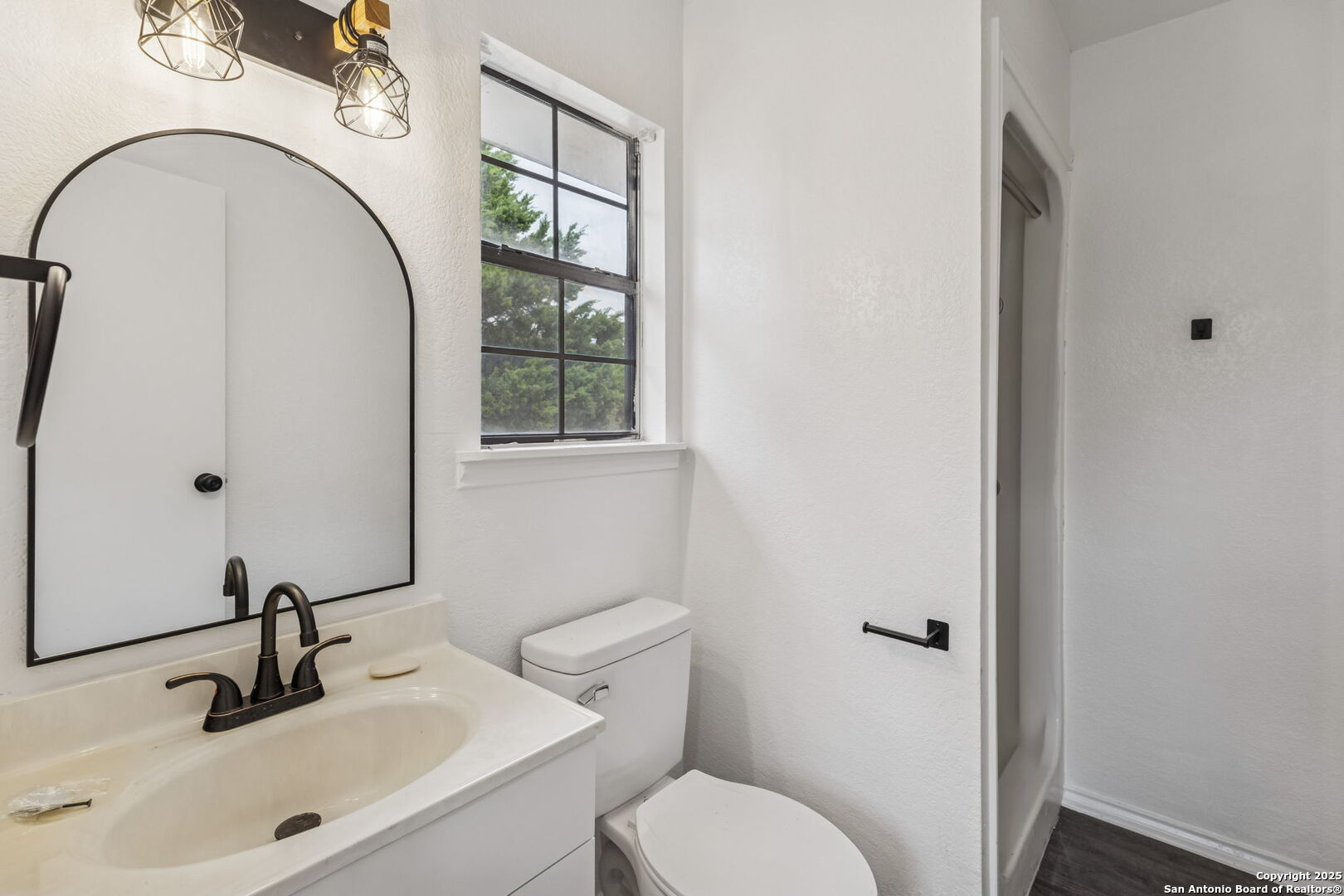 247 Center Point Drive East Center Point, TX 78010 - Photo 63 of 87 a bathroom with a toilet sink and mirror