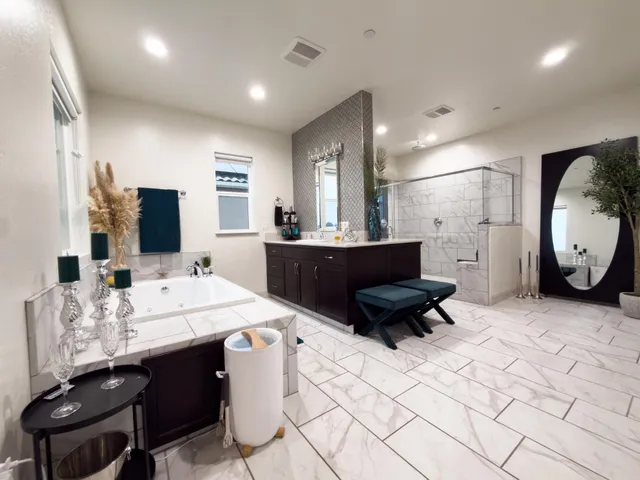 a living room with furniture a flat screen tv and a table