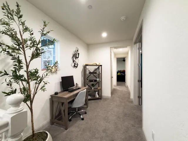 a bedroom with bed and window