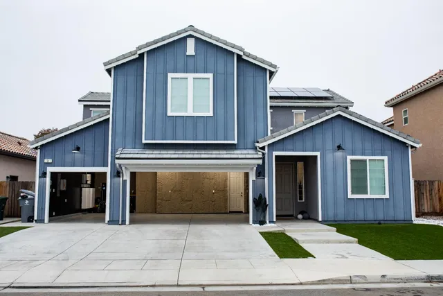 a view of a livingroom with furniture and chandelier