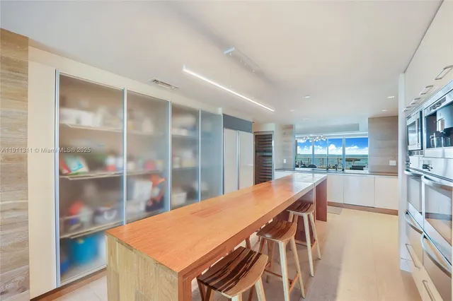 a view of kitchen and dining room with furniture