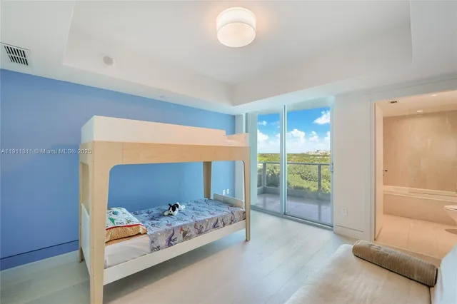 a bedroom with furniture and a window