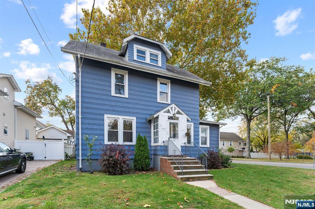 177 East Pierrepont Avenue Rutherford, NJ 07070 - Photo 2 of 27 a front view of a house with a garden