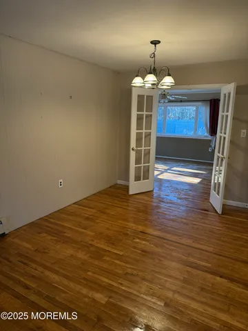 a view of a livingroom with wooden floor