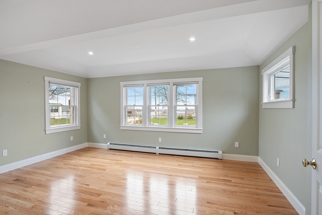 38 Plover Hill Road Ipswich, MA 01938 - Photo 12 of 42 a view of an empty room with wooden floor and a window