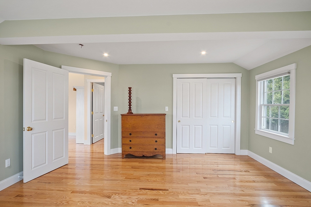38 Plover Hill Road Ipswich, MA 01938 - Photo 13 of 42 a view of an empty room with wooden floor and windows