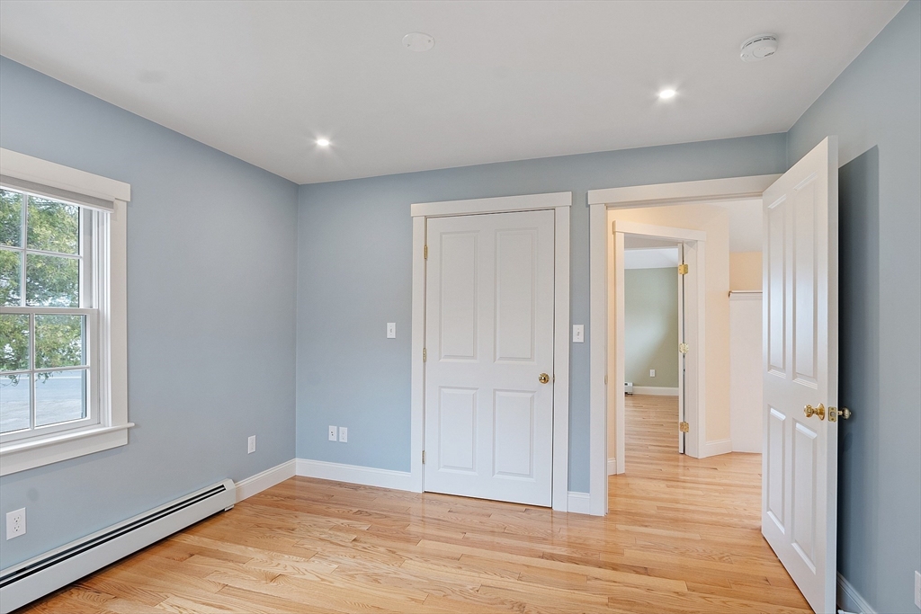 38 Plover Hill Road Ipswich, MA 01938 - Photo 15 of 42 wooden floor in an empty room with a window