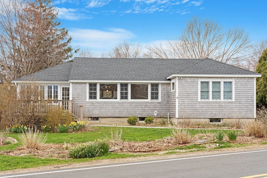 38 Plover Hill Road Ipswich, MA 01938 - Photo 26 of 42 a front view of a house with a garden and yard