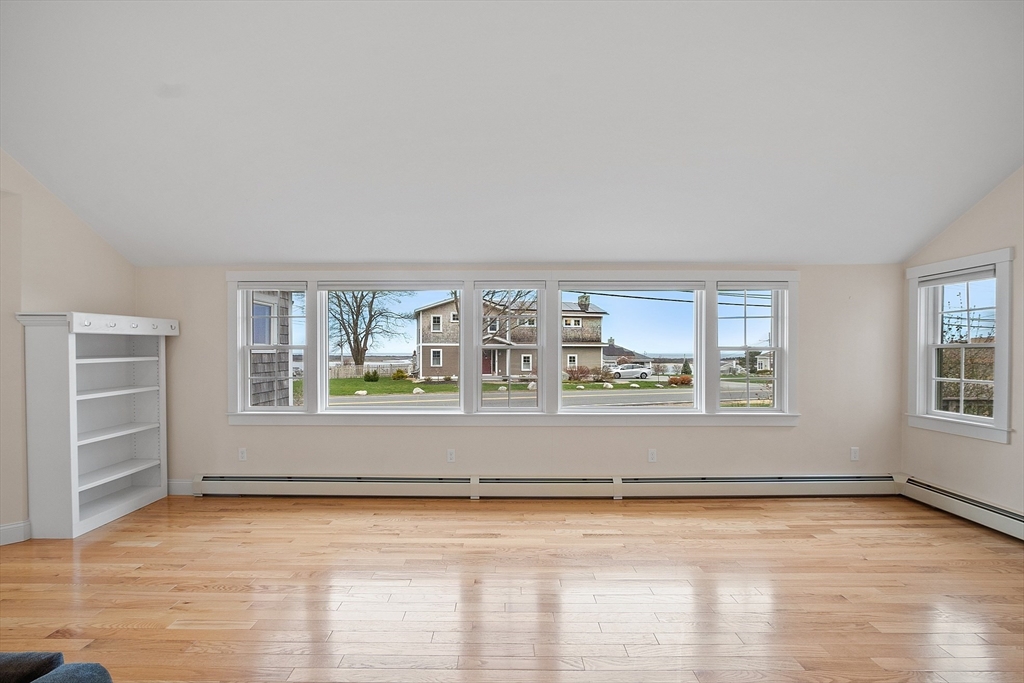 38 Plover Hill Road Ipswich, MA 01938 - Photo 8 of 42 an empty room with wooden floor and windows