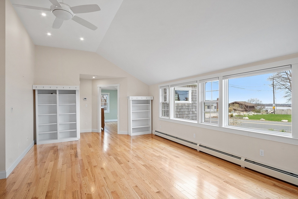 38 Plover Hill Road Ipswich, MA 01938 - Photo 9 of 42 an empty room with wooden floor and windows