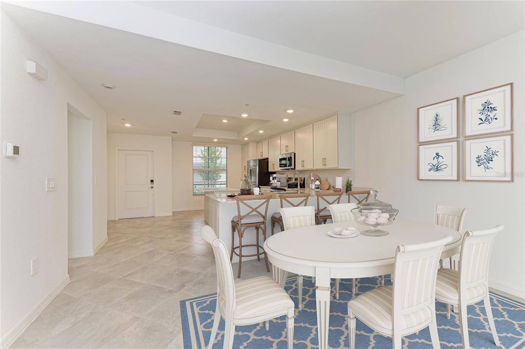 19015 Scallop Loop, Unit 7118 Lakewood Ranch, FL 34211 - Photo 11 of 48 a view of a dining room with furniture