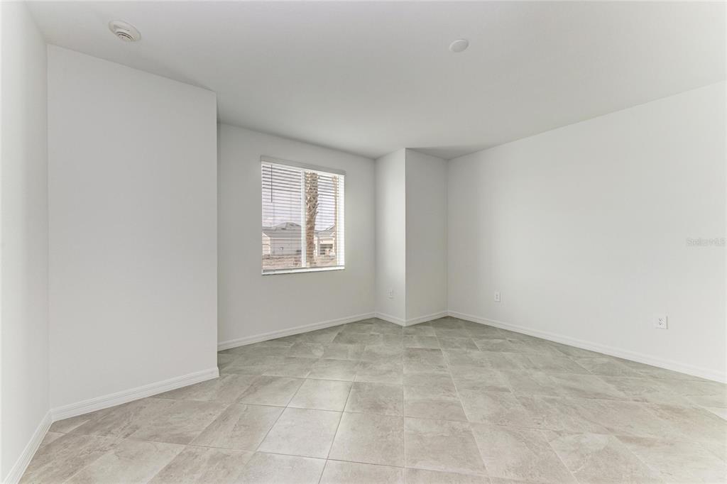 19015 Scallop Loop, Unit 7118 Lakewood Ranch, FL 34211 - Photo 21 of 48 an empty room with windows