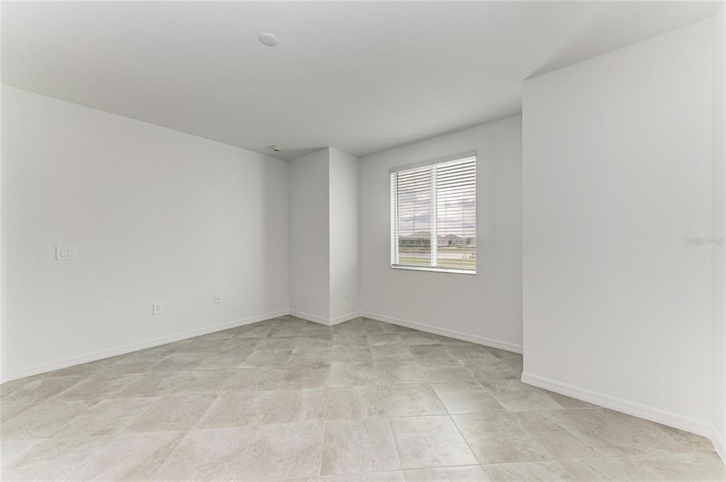 19015 Scallop Loop, Unit 7118 Lakewood Ranch, FL 34211 - Photo 22 of 48 an empty room with windows