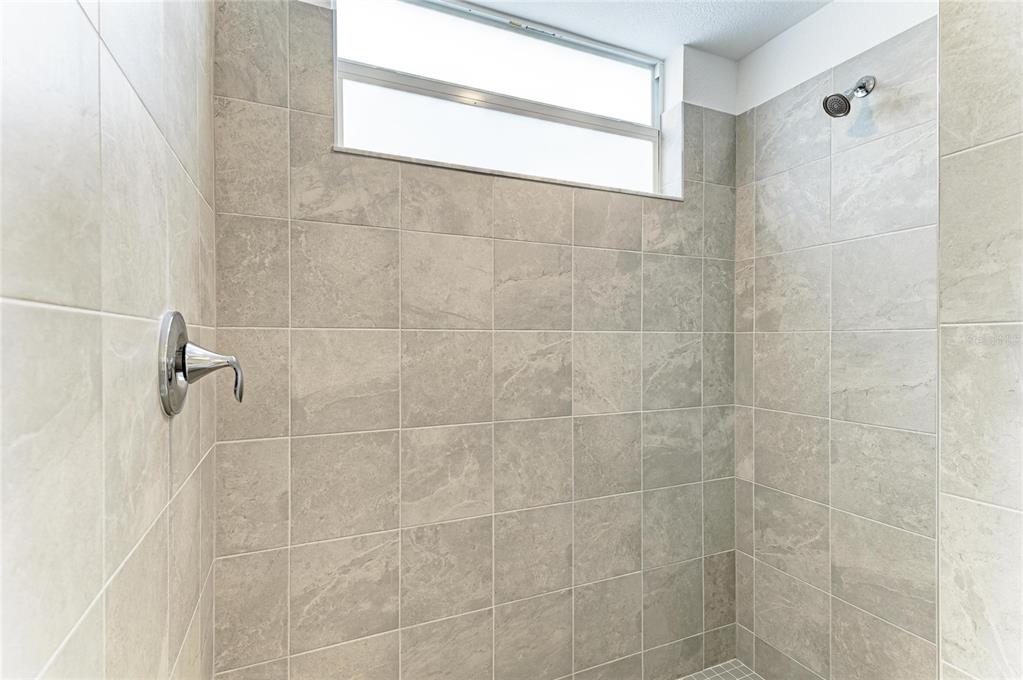 19015 Scallop Loop, Unit 7118 Lakewood Ranch, FL 34211 - Photo 24 of 48 a bathroom with a shower