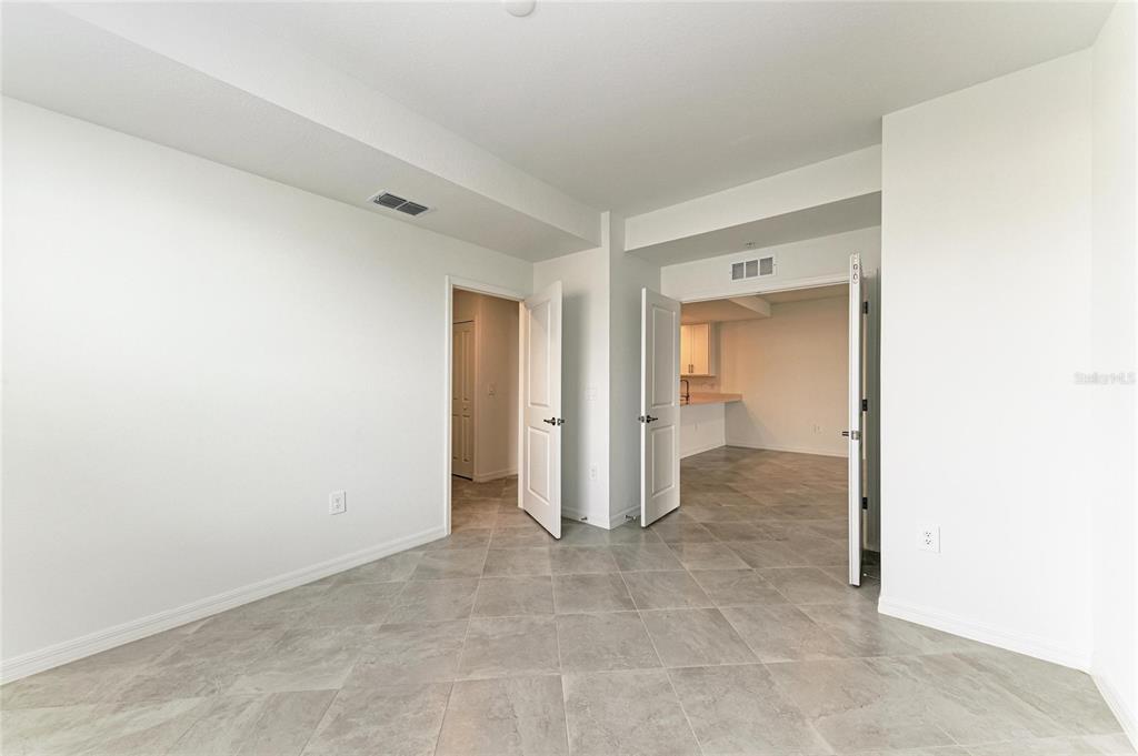 19015 Scallop Loop, Unit 7118 Lakewood Ranch, FL 34211 - Photo 27 of 48 a view of a big room with closet and cabinet