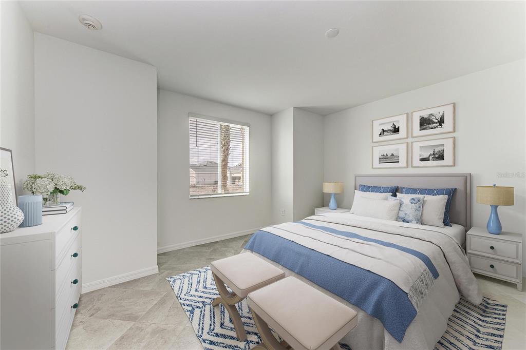 19015 Scallop Loop, Unit 7118 Lakewood Ranch, FL 34211 - Photo 28 of 48 a bedroom with a bed and a table