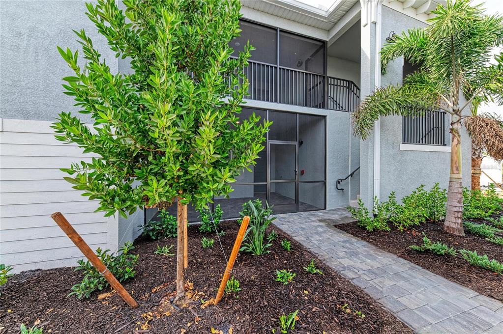 19015 Scallop Loop, Unit 7118 Lakewood Ranch, FL 34211 - Photo 6 of 48 a backyard of a house with lots of green space
