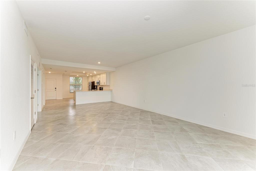 19015 Scallop Loop, Unit 7118 Lakewood Ranch, FL 34211 - Photo 10 of 48 a view of a big room with wooden cabinet and windows
