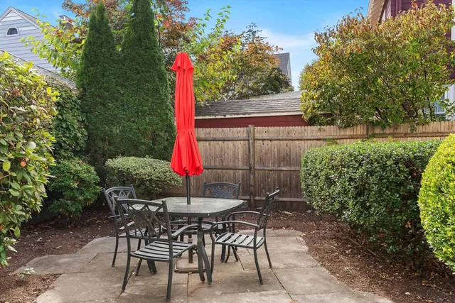 a view of a backyard with sitting area and furniture