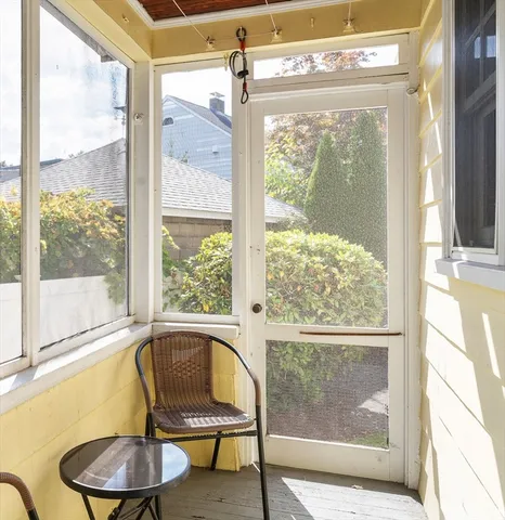 a view of a room with furniture and windows