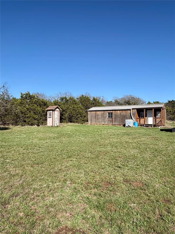 640 M24 Road Ranger, TX 76470 - Photo 9 of 26 a front view of a house with a yard