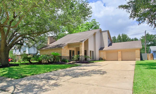 a view of house with yard