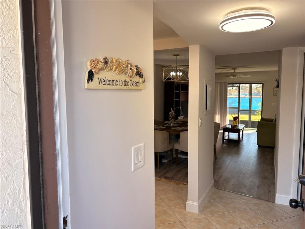 4346 27th Court Southwest, Unit 102 Naples, FL 34116 - Photo 13 of 15 an entryway of a house and a dining room