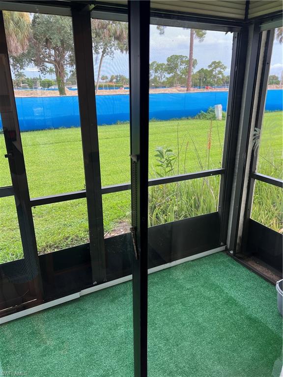 4346 27th Court Southwest, Unit 102 Naples, FL 34116 - Photo 2 of 15 a view of an empty room with a window