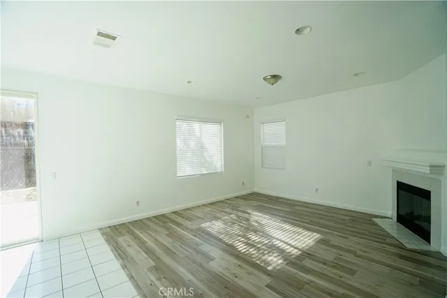 a view of an empty room and a window