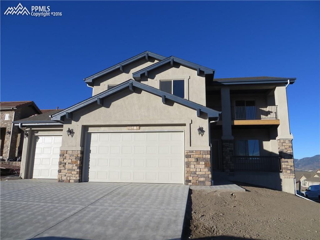 10584 Slumber Ridge Way Colorado Springs, CO 80908 - Photo 1 of 1 Kingsbridge-2 Story-Finished Walk Out Basement-3 Car Garage-Views-Open Concept-Covered Decks-Desirable Bison Ridge Community!