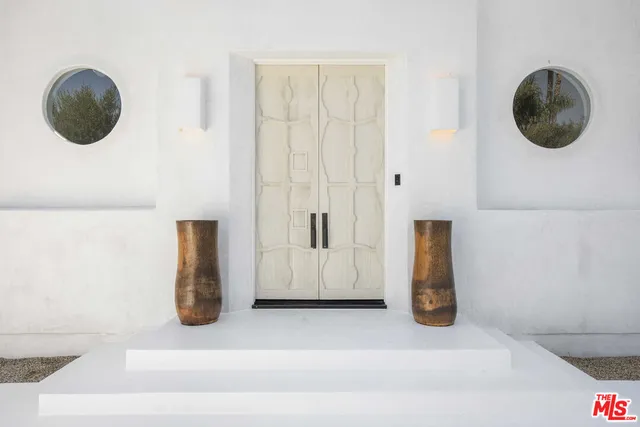 a kitchen with a sink and a mirror