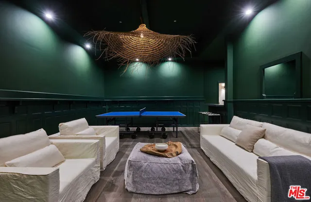 a living room with furniture and a lamp