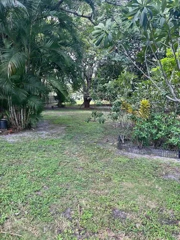 a view of backyard with green space