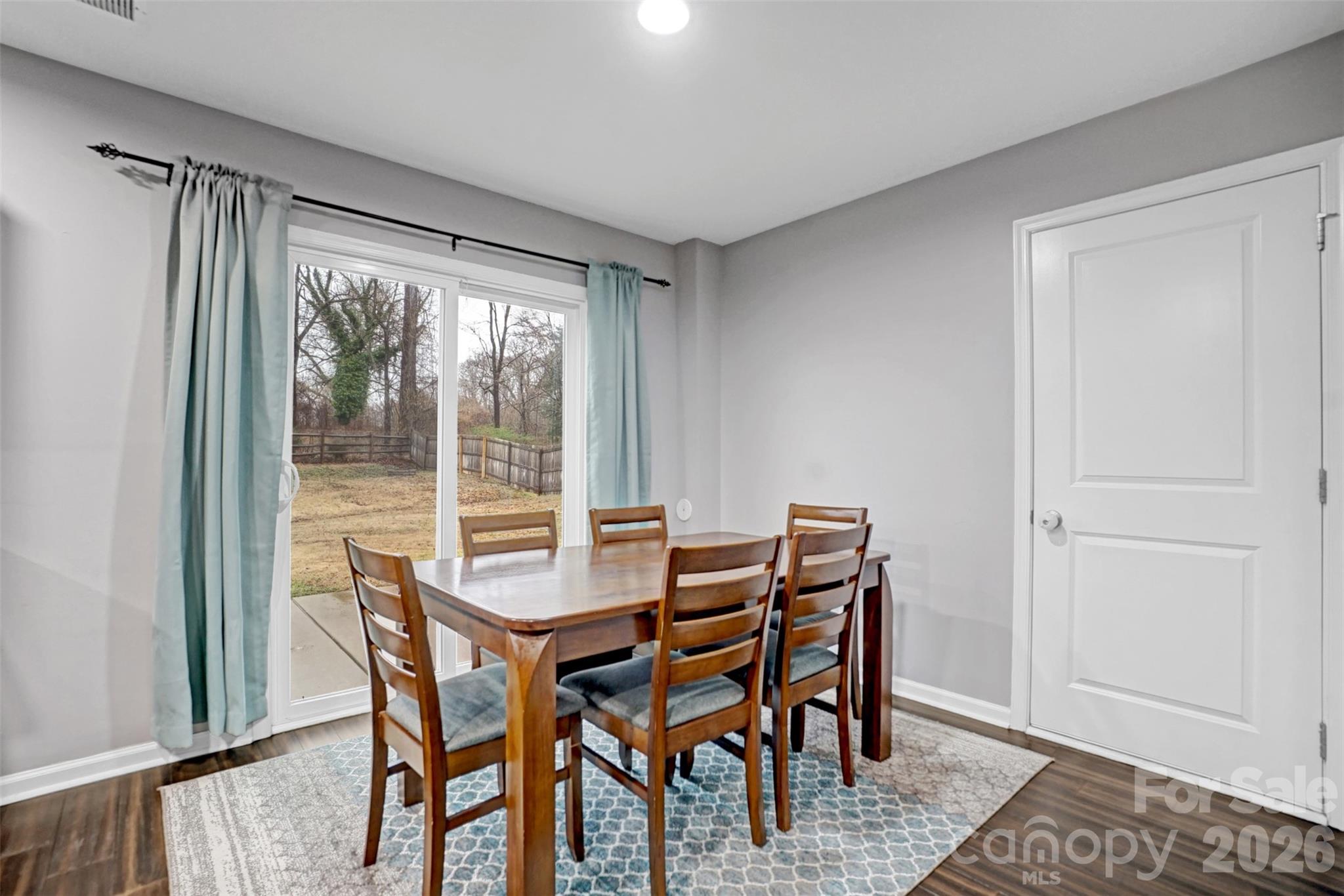 1144 Tangle Ridge Drive Southeast Concord, NC 28025 - Photo 11 of 27 a view of a dining room with furniture window and outside view