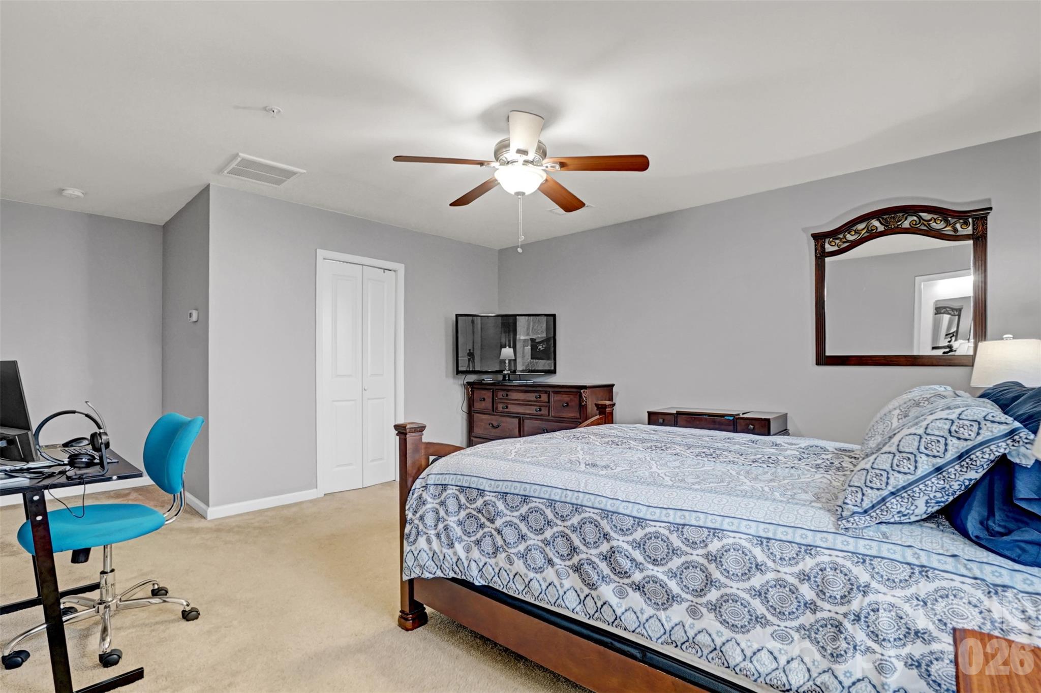 1144 Tangle Ridge Drive Southeast Concord, NC 28025 - Photo 15 of 27 a bedroom with a bed and a tv