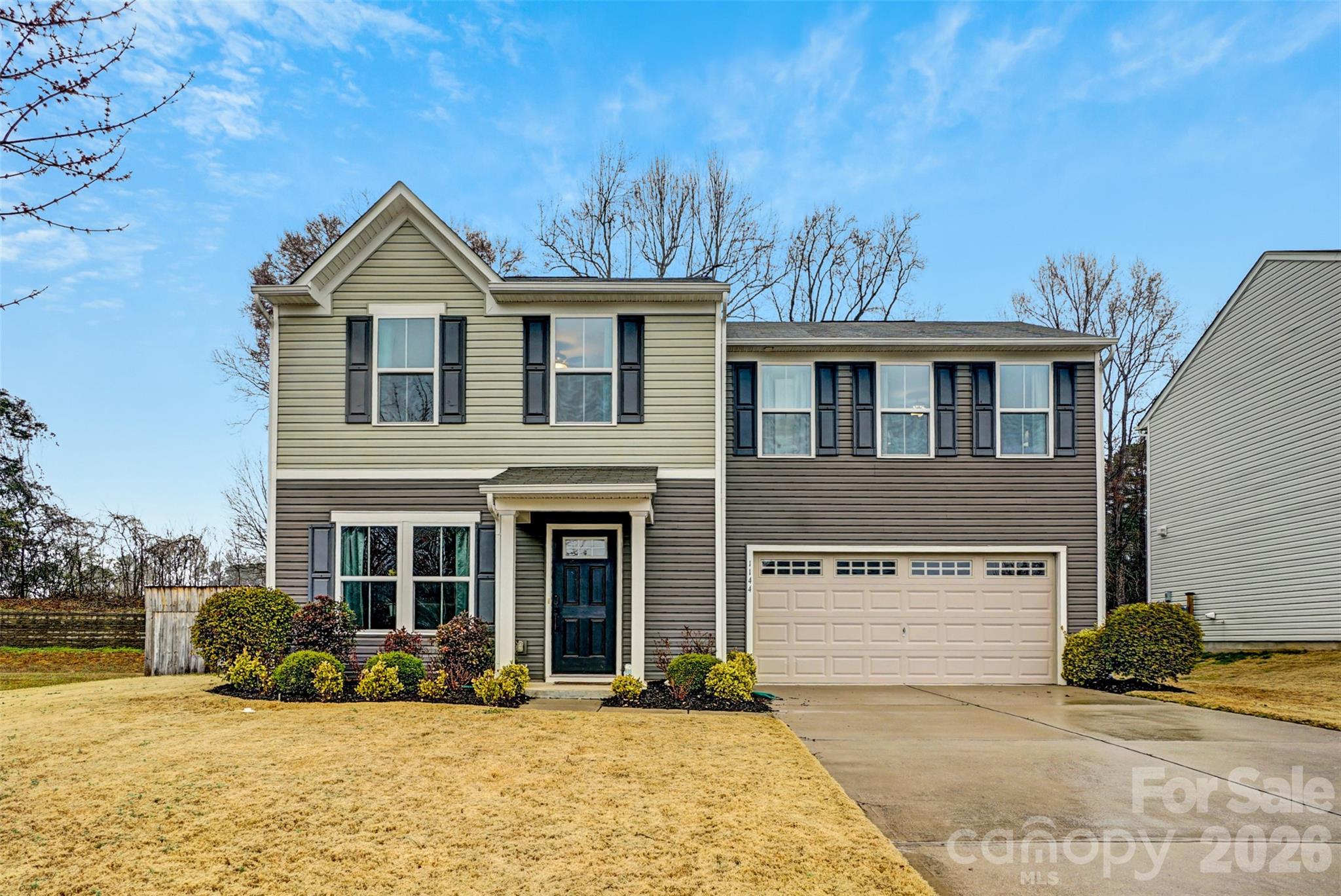 1144 Tangle Ridge Drive Southeast Concord, NC 28025 - Photo 2 of 27 a front view of a house with a yard