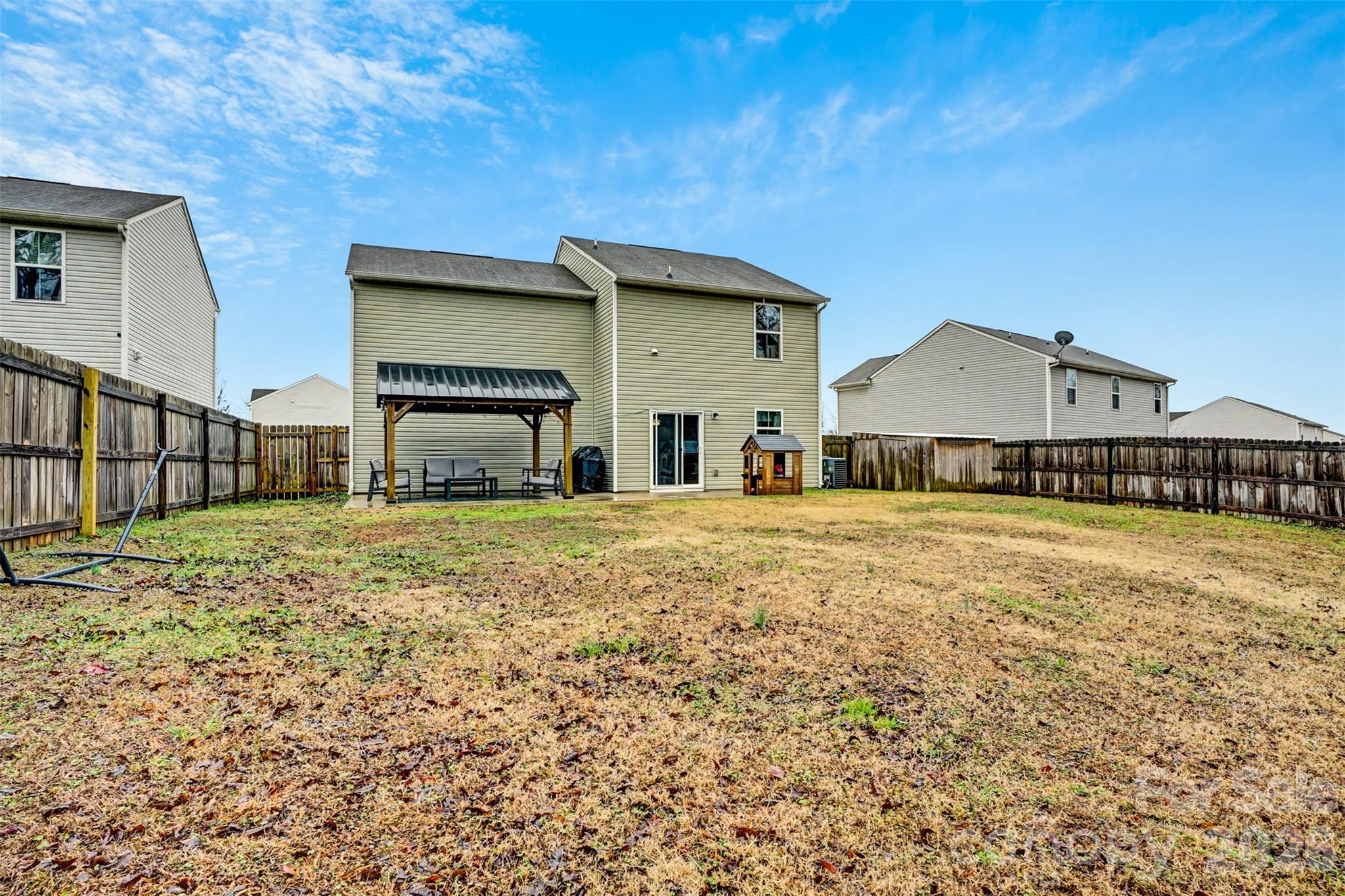 1144 Tangle Ridge Drive Southeast Concord, NC 28025 - Photo 25 of 27 a front view of a house with a yard