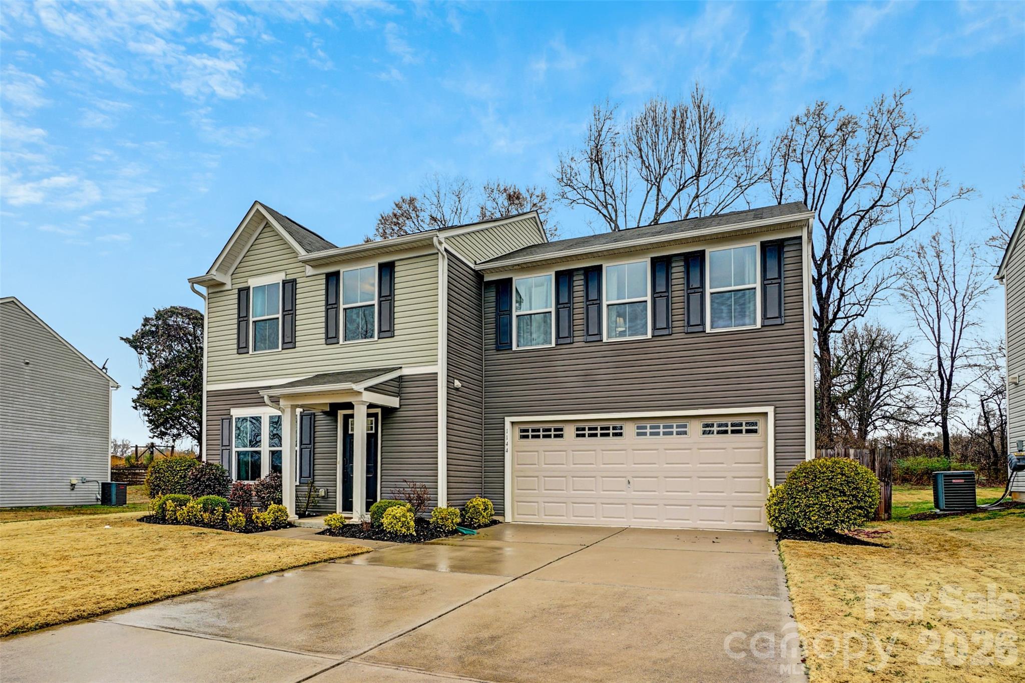 1144 Tangle Ridge Drive Southeast Concord, NC 28025 - Photo 3 of 27 a front view of a house with a yard