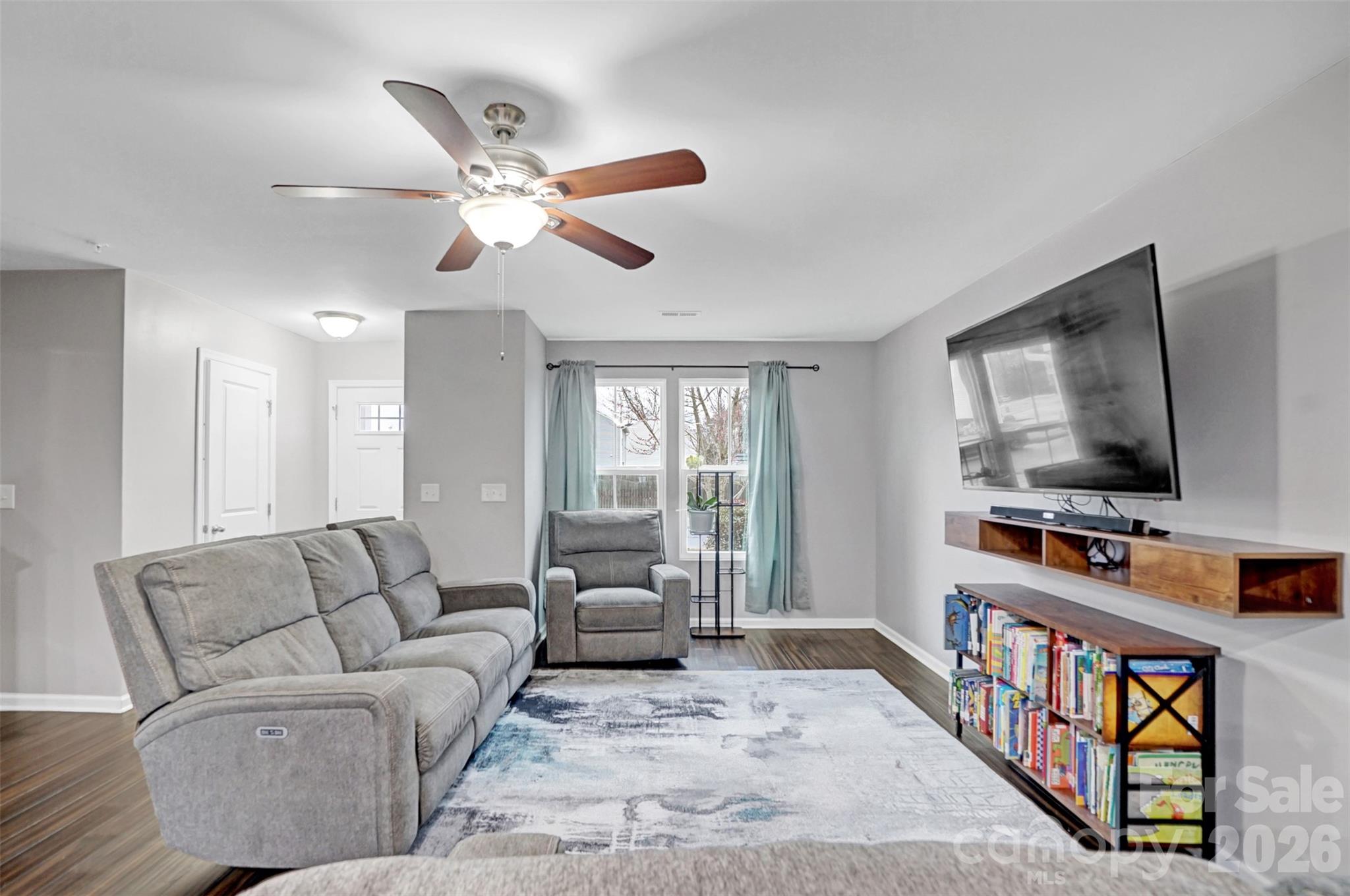 1144 Tangle Ridge Drive Southeast Concord, NC 28025 - Photo 4 of 27 a living room with furniture and a flat screen tv