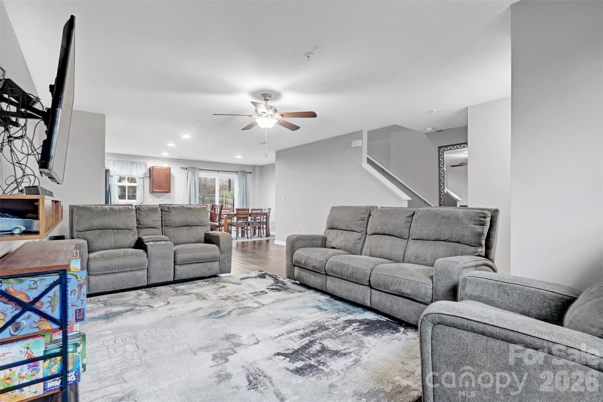 1144 Tangle Ridge Drive Southeast Concord, NC 28025 - Photo 5 of 27 a living room with furniture and a flat screen tv