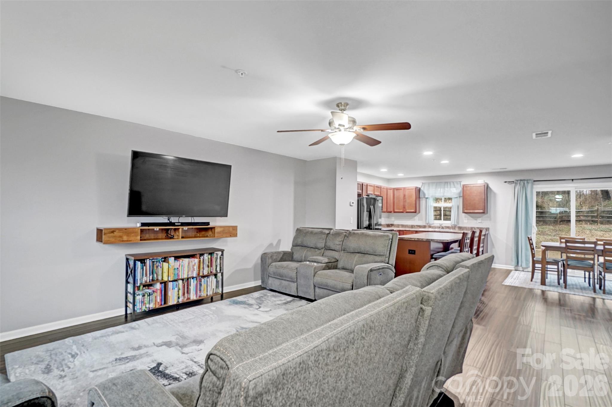 1144 Tangle Ridge Drive Southeast Concord, NC 28025 - Photo 6 of 27 a living room with furniture and a flat screen tv