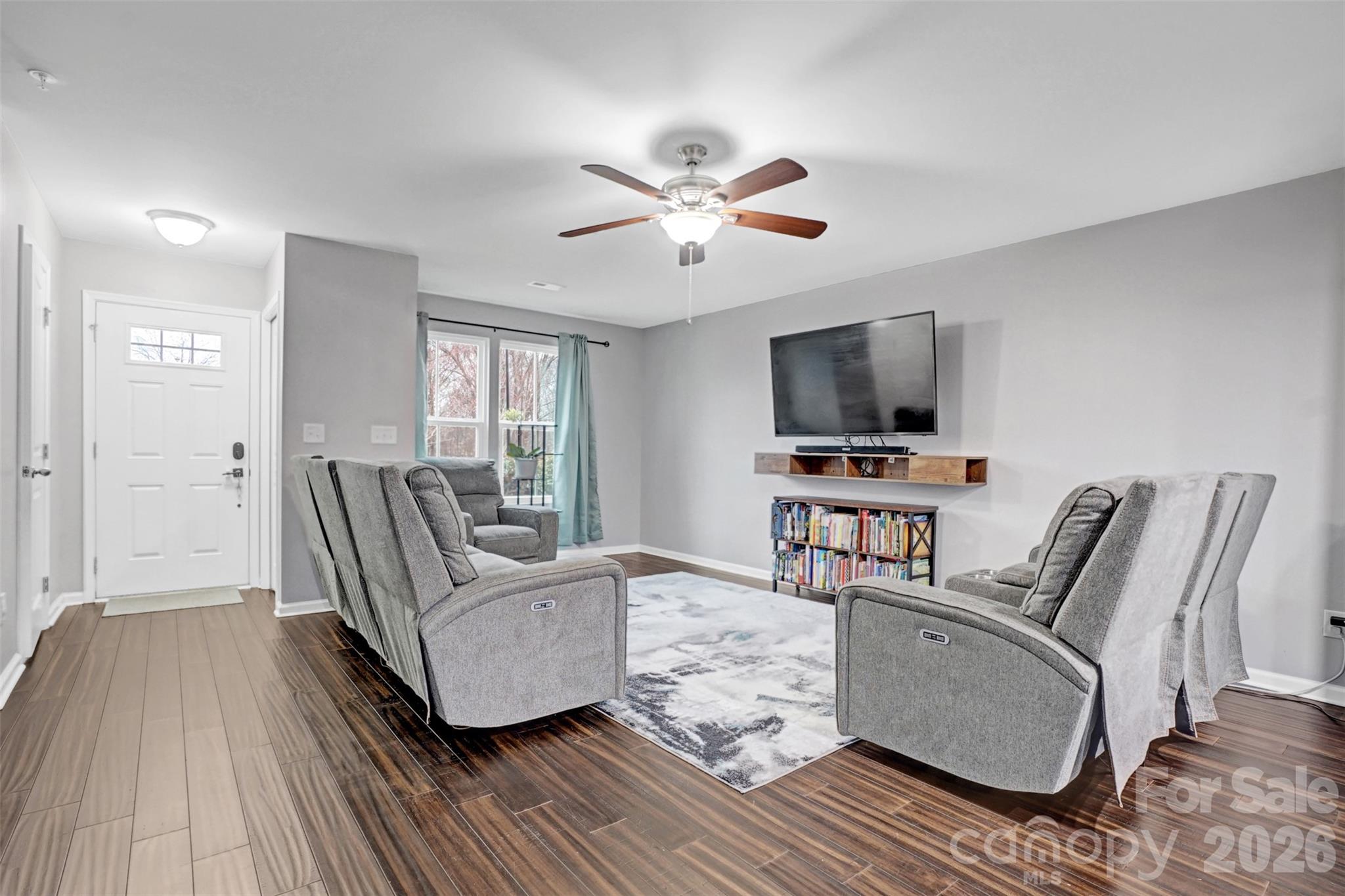 1144 Tangle Ridge Drive Southeast Concord, NC 28025 - Photo 7 of 27 a living room with furniture and a flat screen tv