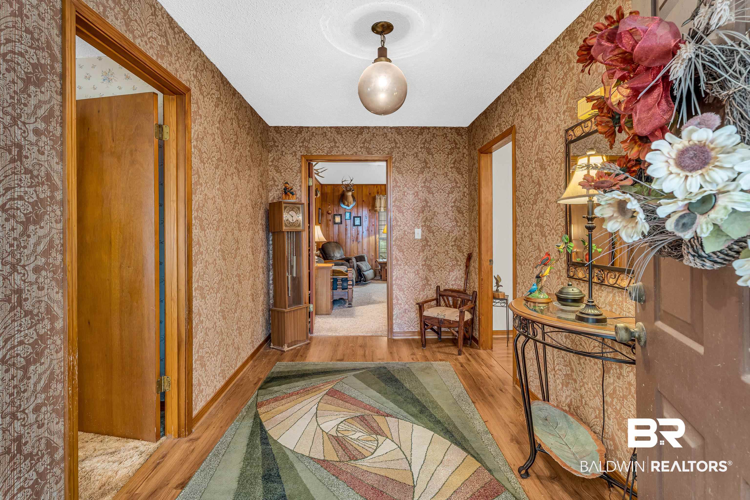 72075 Highway 59 Little River, AL 36550 - Photo 6 of 40 Hall with wood finished floors and wallpapered walls
