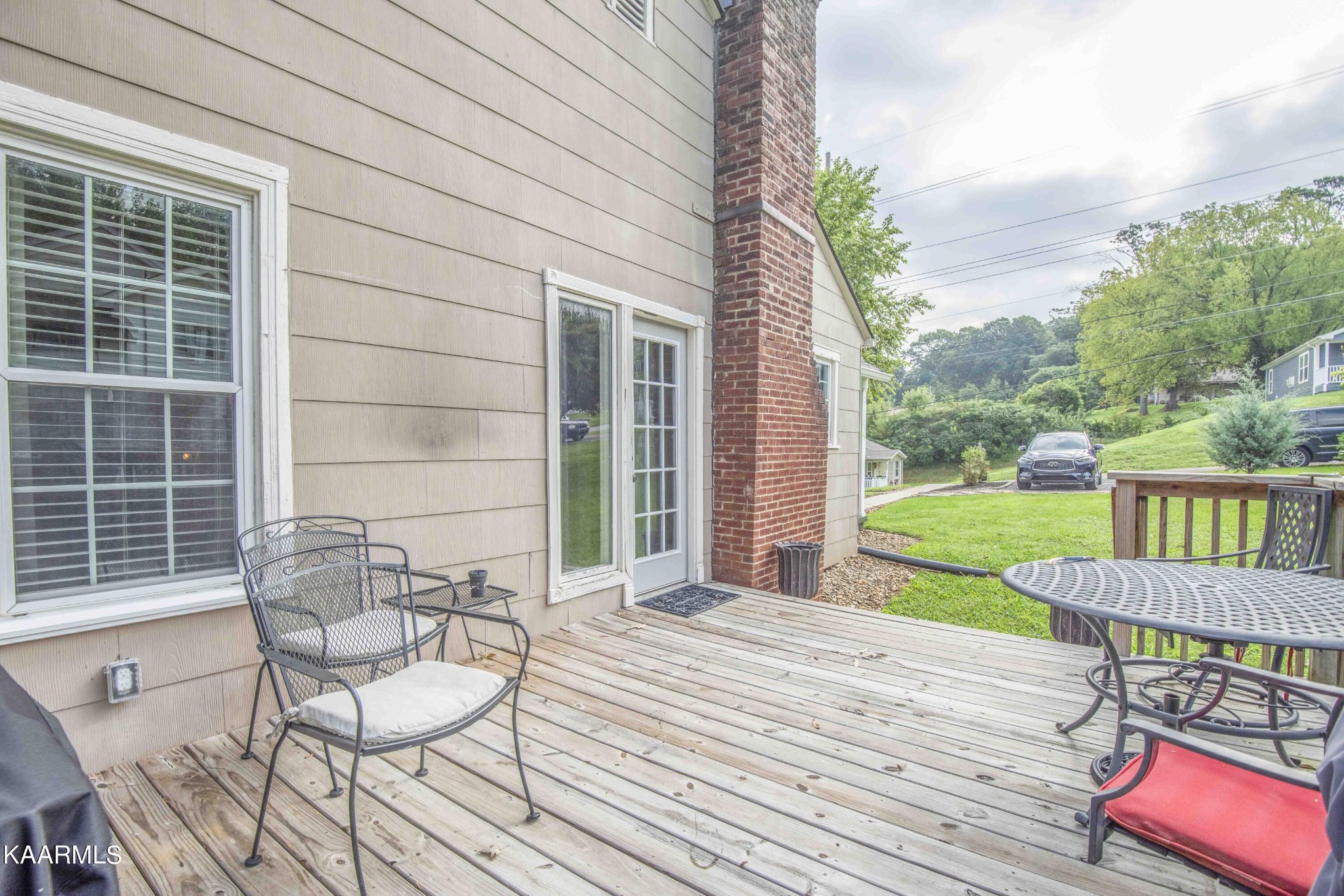 425 Clifton Road Northwest Knoxville, TN 37921 - Photo 27 of 38 a view of a chair and table on the wooden deck