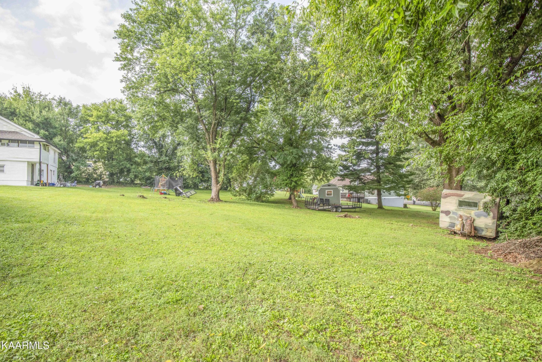 425 Clifton Road Northwest Knoxville, TN 37921 - Photo 33 of 38 a view of a field with trees in front of it