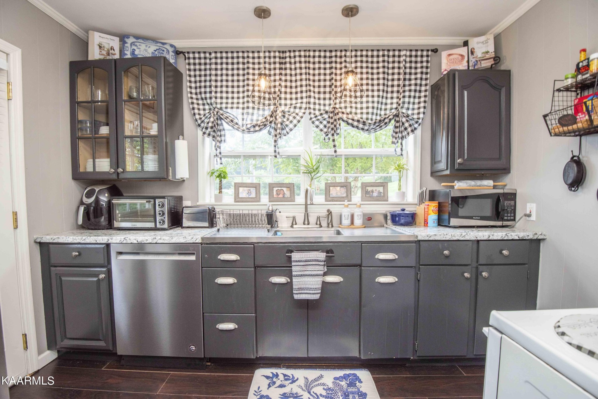 425 Clifton Road Northwest Knoxville, TN 37921 - Photo 4 of 38 a kitchen with stainless steel appliances granite countertop a stove a sink and a microwave