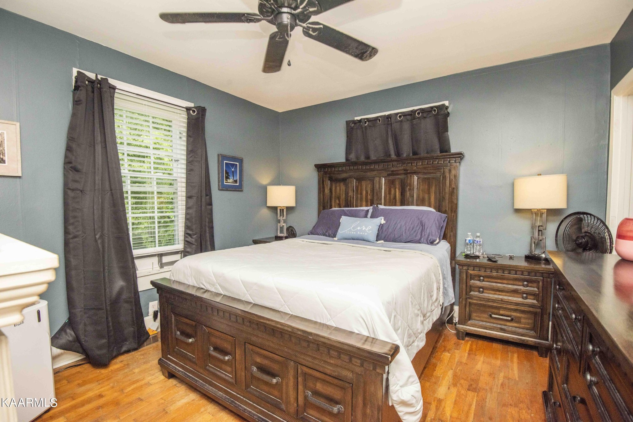 425 Clifton Road Northwest Knoxville, TN 37921 - Photo 5 of 38 a bedroom with a bed and a chandelier