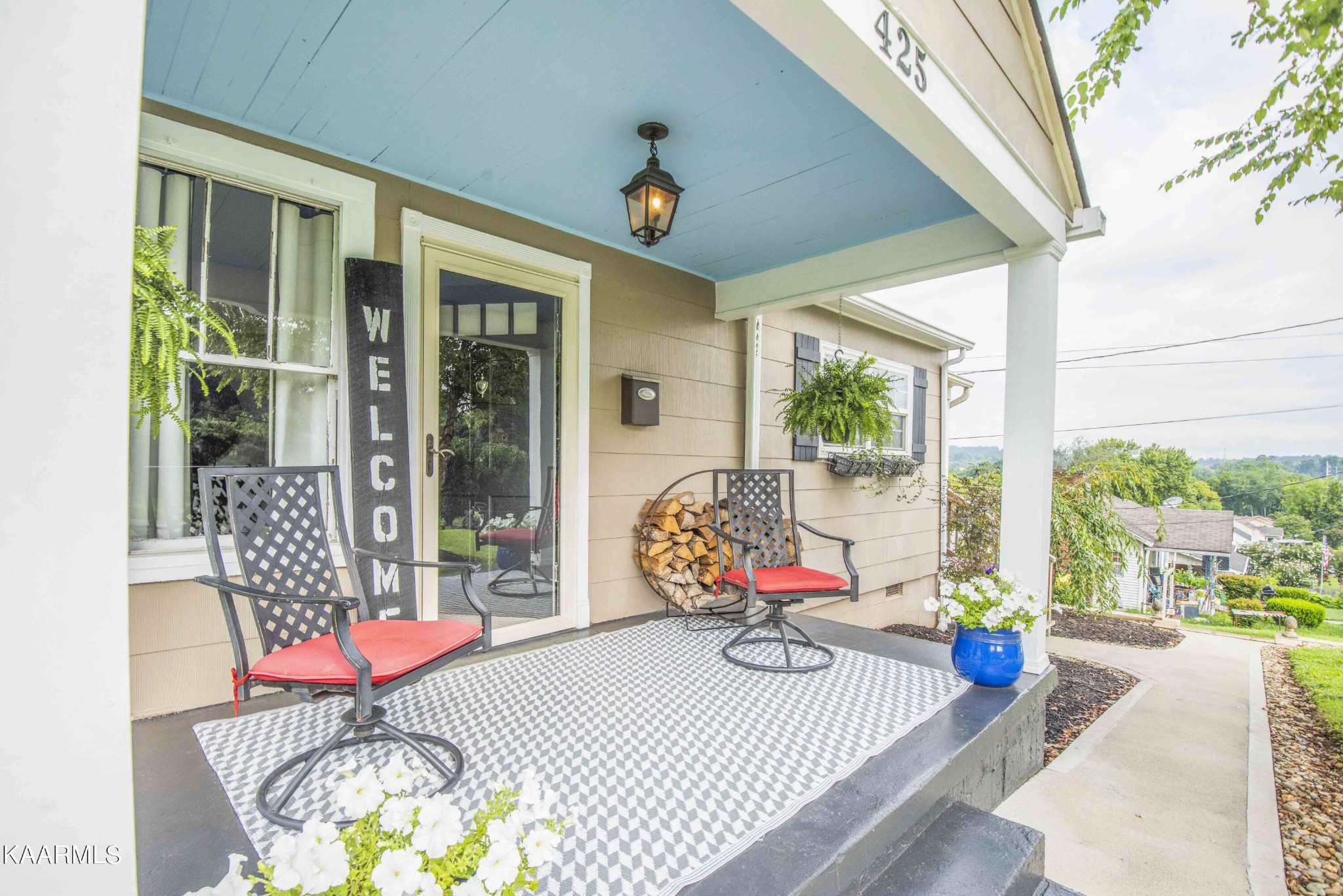 425 Clifton Road Northwest Knoxville, TN 37921 - Photo 6 of 38 a front view of a house with swimming pool and sitting area