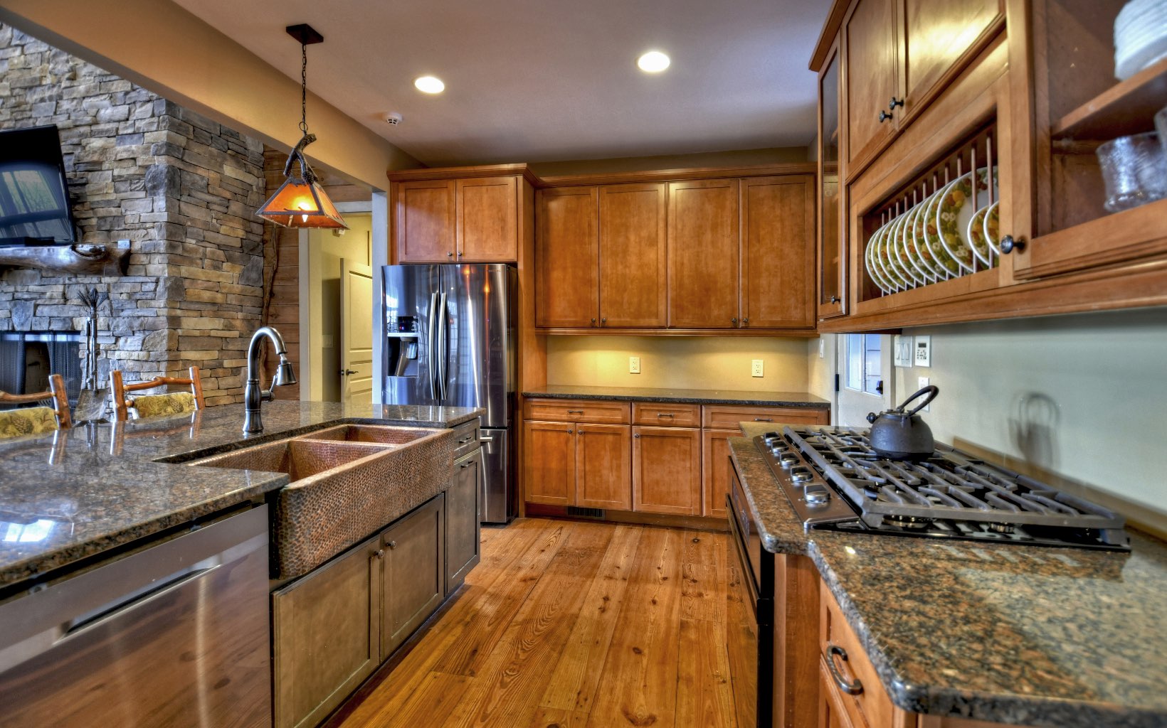 773 Heards Ridge Morganton, GA 30560 - Photo 16 of 54 a kitchen with stainless steel appliances granite countertop a stove a sink and a microwave